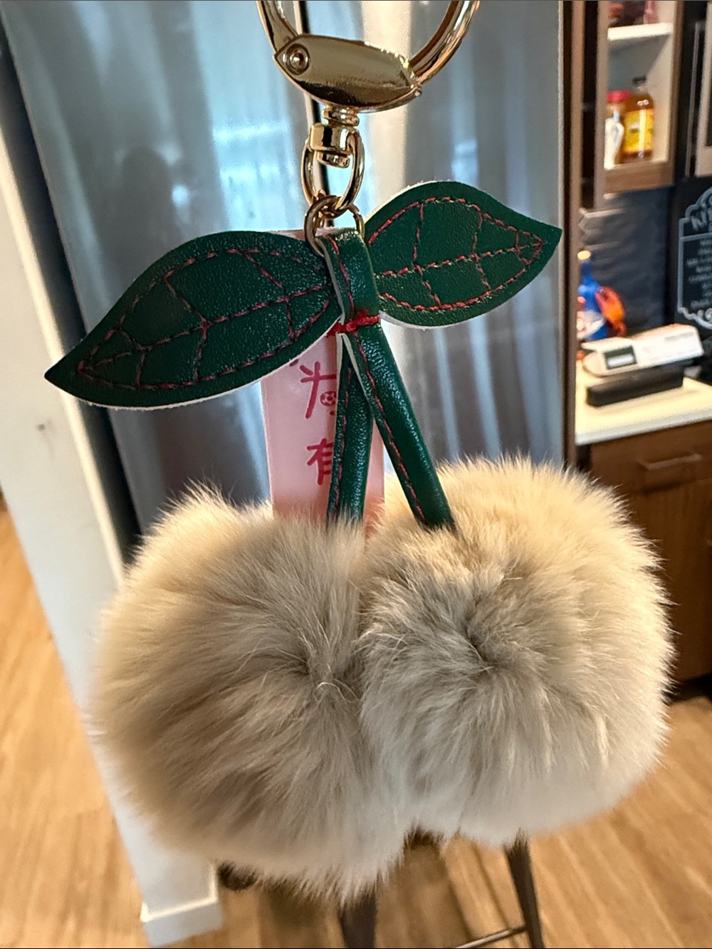 Beige Faux Fur Cherry Keychain with Green Leaf Accent